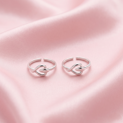 Two 925 silver adjustable toe rings with a heart-shaped knot design