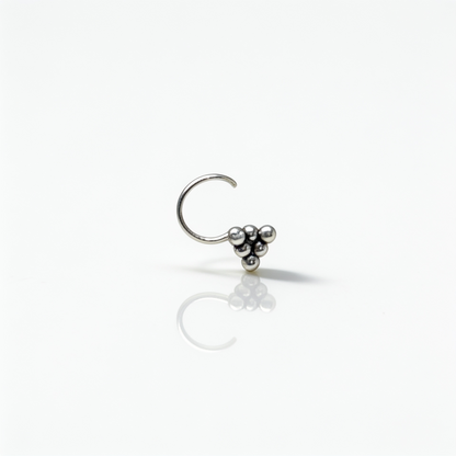 Minimalist 925 sterling silver nose pin featuring three tiny silver beads arranged in a triangular pattern.