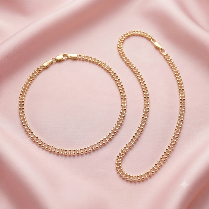 A gold-toned beaded chain anklet set