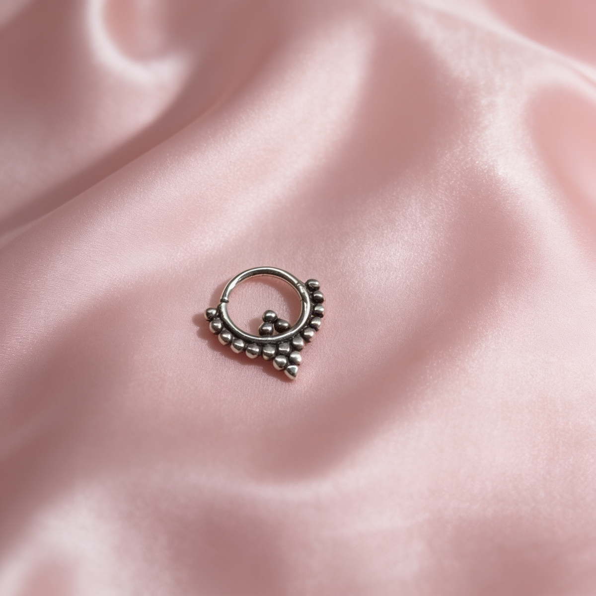 Oxidised 925 sterling silver beaded septum nose ring featuring a distinctive arrow-shaped centre detail.